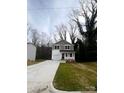 Charming two-story home with a well-manicured lawn and a concrete driveway at 423 Rocky Brook Dr, Shelby, NC 28150