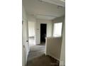 Upstairs hallway with hardwood floors and views into other rooms at 423 Rocky Brook Dr, Shelby, NC 28150