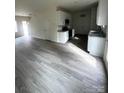Spacious living room and kitchen featuring hardwood floors and modern appliances at 423 Rocky Brook Dr, Shelby, NC 28150