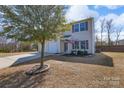 Charming two-story home featuring a two-car garage and well-maintained front yard with tree at 4314 Penrose Ct, Clover, SC 29710