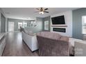 This modern living room features a fireplace, mounted TV, and comfortable seating at 4314 Penrose Ct, Clover, SC 29710