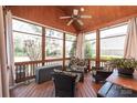 Cozy screened porch with comfortable seating and wood accents at 6141 Abergele Ln, Matthews, NC 28104