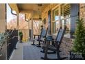 Cozy front porch with comfortable seating and decorative plants, perfect for relaxing outdoors at 944 Clear Creek Cir, Lincolnton, NC 28092