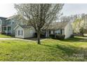 A well-maintained lawn and blooming tree enhance the curb appeal of this home at 134 Chere Helen Dr, Mooresville, NC 28115
