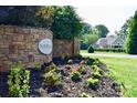 Stone community entrance sign with flower beds and landscaping at 145 High Rock Ct # 03, Statesville, NC 28677