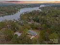 Stunning aerial view of lakefront home surrounded by lush trees and serene waters at 1614 Fieldbrook Rd, Rock Hill, SC 29732