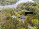 Aerial view of lakeside home with surrounding trees and dock access at 1614 Fieldbrook Ln at 1614 Fieldbrook Rd, Rock Hill, SC 29732