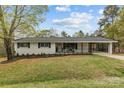 Well-maintained single-story home with an inviting front porch and covered parking at 1614 Fieldbrook Rd, Rock Hill, SC 29732