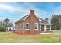 Brick home featuring multiple windows and a chimney at 2005 Douglas Rd, Lancaster, SC 28720