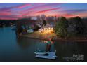 Gorgeous lakefront home with a private dock, and beautifully landscaped backyard at 213 Morgan Bluff Rd, Mooresville, NC 28117