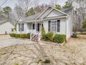 Charming single-story home featuring a well-manicured lawn and a welcoming front porch, perfect for enjoying the outdoors at 314 Sugar Creek Xing, Fort Mill, SC 29715