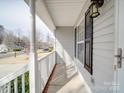 Inviting porch offering a cozy space to relax, enhanced by classic architectural details and a pleasant neighborhood view at 314 Sugar Creek Xing, Fort Mill, SC 29715