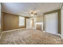 Comfortable bedroom featuring a ceiling fan, and neutral walls, creating a versatile and peaceful retreat at 36 Brookline St, Great Falls, SC 29055