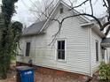 Side view of the one-story home showing the exterior wall and foundation at 517 Western Ave, Statesville, NC 28677