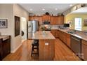 Well-appointed kitchen featuring stainless steel appliances, a center island, and ample cabinet space at 8107 Crater Lake Dr, Indian Land, SC 29707