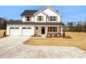 Charming two-story home featuring a two-car garage and manicured landscaping at 1044 Margrace Rd, Kings Mountain, NC 28086