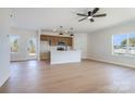 Open-concept living room with light wood floors and a view of the kitchen at 1044 Margrace Rd, Kings Mountain, NC 28086