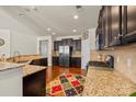 Modern kitchen featuring granite countertops, stainless steel appliances, and ample cabinet space at 10714 Sapphire Trl, Davidson, NC 28036