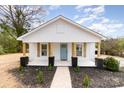 Charming home featuring new landscaping, rustic wood accents and a welcoming covered front porch at 108 Arlene Ave, Kannapolis, NC 28081