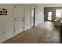Spacious open-concept living room features new flooring and neutral decor for a bright living space at 121 Irving Ave, Mooresville, NC 28117