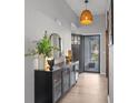 Welcoming foyer showcases a modern light fixture, stylish console table, and elegant decor at 1336 Eisenhower Nw Pl, Concord, NC 28027