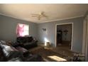 Inviting living room with natural light streaming through the windows at 142 Fletcher Sw Ct, Concord, NC 28027