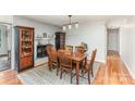 Traditional dining room with hardwood floors, a fireplace, and ample seating space at 2156 Flynn Dr, Gastonia, NC 28054