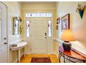 Bright foyer with hardwood floors, decorative glass, and stylish wall accents at 2316 Winding River Dr, Charlotte, NC 28214
