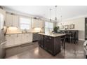 Bright kitchen featuring granite counters, stainless steel appliances, and a central island at 2455 Seagull Dr # 62, Denver, NC 28037