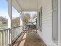 This covered front porch offers a swing for relaxing and enjoying the views, enhancing the home's curb appeal at 2602 Cherokee Ct, Gastonia, NC 28056