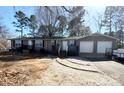 Charming single-story home featuring a two-car garage and inviting front porch with a stone walkway at 3807 Woodlawn St, Sharon, SC 29742