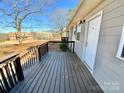 Inviting covered front porch featuring a dark wood deck and painted exterior at 3807 Woodlawn St, Sharon, SC 29742