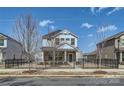 Inviting two-story home with a charming front yard and secure black metal fence at 428 Nixon Rd, Belmont, NC 28012