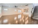 Bright, open-concept living room with hardwood floors and a view of the modern kitchen at 428 Nixon Rd, Belmont, NC 28012