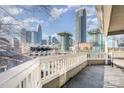 Balcony featuring Charlotte skyline view with railing offering an exceptional urban living experience at 433 W 8Th St, Charlotte, NC 28202