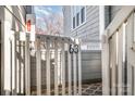 Close-up of unit entrance with secure gated access to a well-maintained gray condo building at 433 W 8Th St, Charlotte, NC 28202