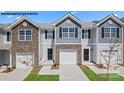 Charming townhome exterior with stone accents, attached garage, and well-maintained landscaping at 535 Trading Post Ln, York, SC 29745