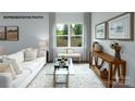 Cozy living room featuring neutral tones, natural light, and comfortable seating at 535 Trading Post Ln, York, SC 29745