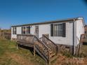 A cozy home featuring a deck, offering a welcoming outdoor space at 5448 Bill Sain Rd, Vale, NC 28168