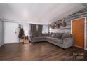Comfortable living room with a large sectional sofa and stylish wall decor at 5448 Bill Sain Rd, Vale, NC 28168