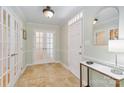 Inviting foyer features tiled floors, and glass paneled doors, offering a bright and welcoming entrance at 601 Highland Forest Dr, Charlotte, NC 28270