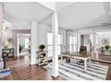 Bright home office featuring hardwood floors, white trim, large windows, and ample natural light at 6200 Summertree Ln, Charlotte, NC 28226