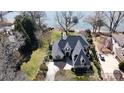 Stunning aerial view showcasing the house's architecture, landscaping, and proximity to the waterfront at 6403 Amos Smith Rd, Charlotte, NC 28214