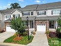 Beautiful townhome exterior with stone accents, attached garage, and well-maintained landscaping at 769 River Park Rd, Belmont, NC 28012
