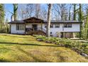Charming exterior elevation features a covered porch, open carport, and beautiful landscaping at 910 Forest Dr # 14, Lancaster, SC 29720