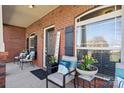 Inviting front porch decorated with potted plants and comfortable seating area at 112 Jobe Dr, Statesville, NC 28677