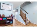 Open foyer featuring wood flooring, a staircase, and light-blue wall paint at 11416 Leadenhall Ln # 22, Charlotte, NC 28262