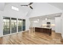 Spacious open concept living area with hardwood floors, kitchen with island and vaulted ceilings at 1157 Bunch Dr, Statesville, NC 28677