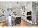 Bright kitchen showcasing a spacious island, stainless appliances, and ample cabinet space at 215 Wesley Manor Dr, Matthews, NC 28104
