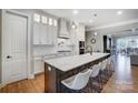 Modern kitchen featuring a large center island, stainless steel appliances, and custom cabinetry at 215 Wesley Manor Dr, Matthews, NC 28104